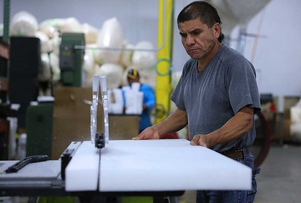 <strong>Manuel Llamas cuts a sheet of foam packing material into smaller strips at GLS Integrated on Thursday Oct. 4. After only six months of operations, GLS is preparing to more than double its current space at 4841 Cromwell Ave.</strong> <strong>in Memphis&rsquo; southeast industrial district.</strong> (Patrick Lantrip/Daily Memphian)