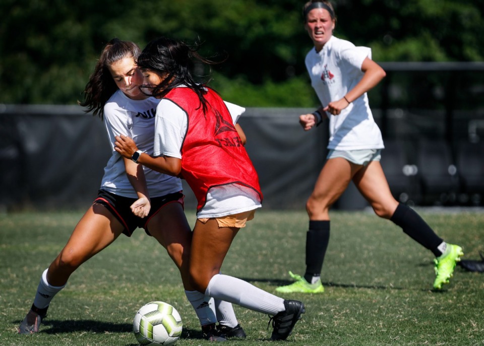 <strong>Houston High School girls soccer teammates Kate O&rsquo;Connor (left) battles Lauren Fang (right) during practice on Wednesday, August 5, 2020.</strong> (Mark Weber/Daily Memphian file)