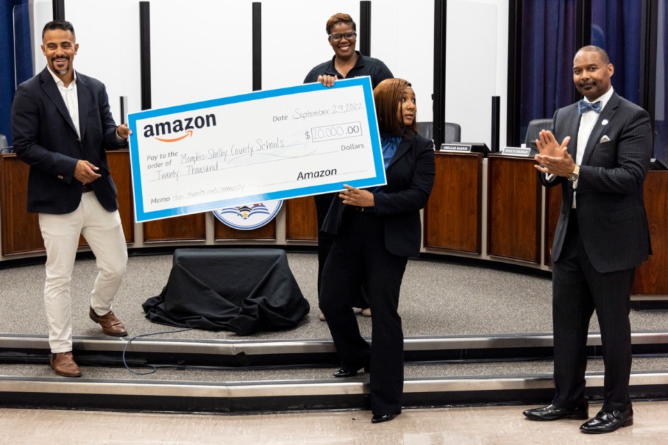 <strong>MSCS Interim Superintendent Toni Williams, second from left, accepts a check from Amazon during the Memphis-Shelby County Schools and Amazon School partnership ceremony on Wednesday.</strong> (Brad Vest/Special to The Daily Memphian