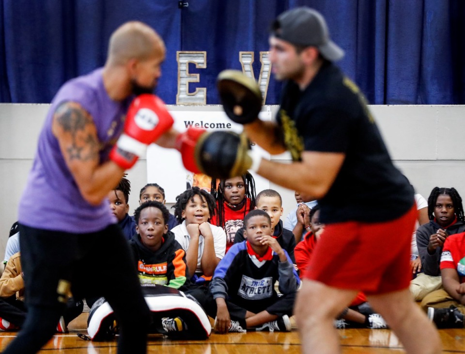 <strong>Levi Elementary student watch as professional boxer Michael Cook (left) puts on a demonstration on Wednesday, Sept. 28, 2022.</strong> (Mark Weber/The Daily Memphian)