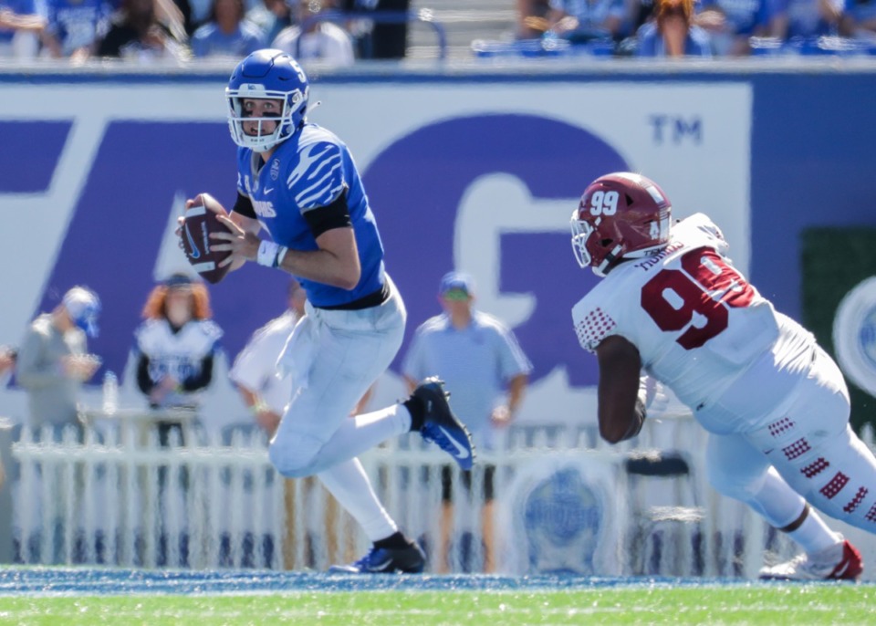 <strong>University of Memphis quarterback Seth Henigan scrambles out of the pocket during a Oct. 1, 2022 game against Temple.</strong> (Patrick Lantrip/Daily Memphian)