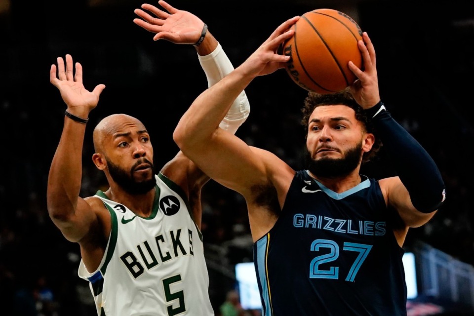 <strong>Memphis Grizzlies' David Roddy drives past Milwaukee Bucks' Jevon Carter during the second half of an NBA preseason basketball game Saturday, Oct. 1, 2022, in Milwaukee.</strong> (Morry Gash/AP)