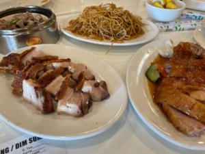 <strong>From back left: Steamed spare ribs, supreme soy sauce fried noodles, roasted duck and Cantonese roast pork belly. Dishes like these are served from carts at Dim Sum King.</strong> (Jennifer Biggs/The Daily Memphian)