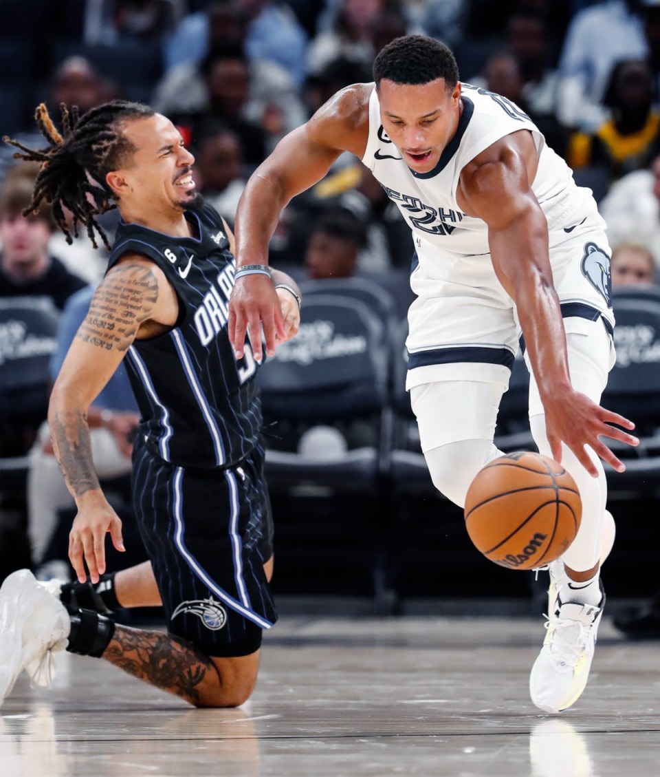 <strong>Memphis Grizzlies defender Desmond Bane (right) grabs a loose ball in front of Orlando Magic guard Cole Anthony (left) on Monday, Oct. 3, 2022.</strong> (Mark Weber/The Daily Memphian)