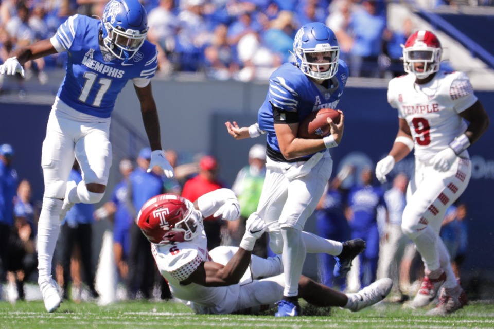 <strong>After University of Memphis quarterback Seth Henigan shed a couple of tackles to break for a 19-yard gain in the third quarter against Temple, the offense says they were lit up.</strong> (Patrick Lantrip/The Daily Memphian)