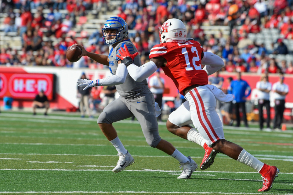 <strong>Memphis Tigers quarterback Brady White (3) is flushed from the pocket by Houston Cougars defensive lineman David Anenih (12) during the football game between the Memphis Tigers and Houston Cougars at TDECU Stadium on November 16, 2019 in Houston.</strong> (Credit: Ken Murray/Icon Sportswire via AP Images)
