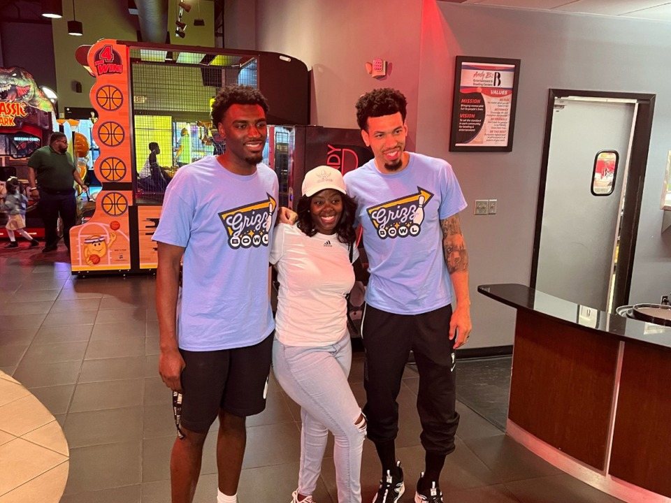 <strong>Vince Williams Jr. (left) and Danny Green (right) with a fan at Wednesday&rsquo;s Grizzlies Bowling event at Andy B&rsquo;s Bowl Social to benefit St. Jude Children&rsquo;s hospital.</strong>(Drew Hill/The Daily Memphian)