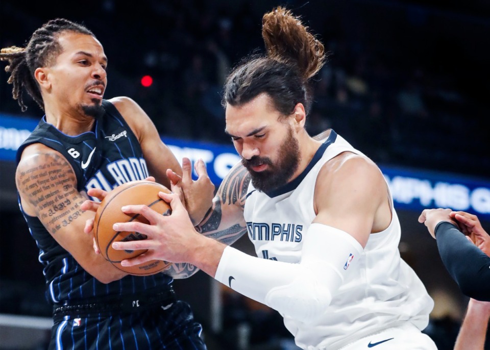 <strong>Memphis Grizzlies center Steven Adams (right) battles Orlando Magic defender Cole Anthony (left) for a rebound during action on Monday, Oct. 3, 2022.</strong> (Mark Weber/The Daily Memphian)