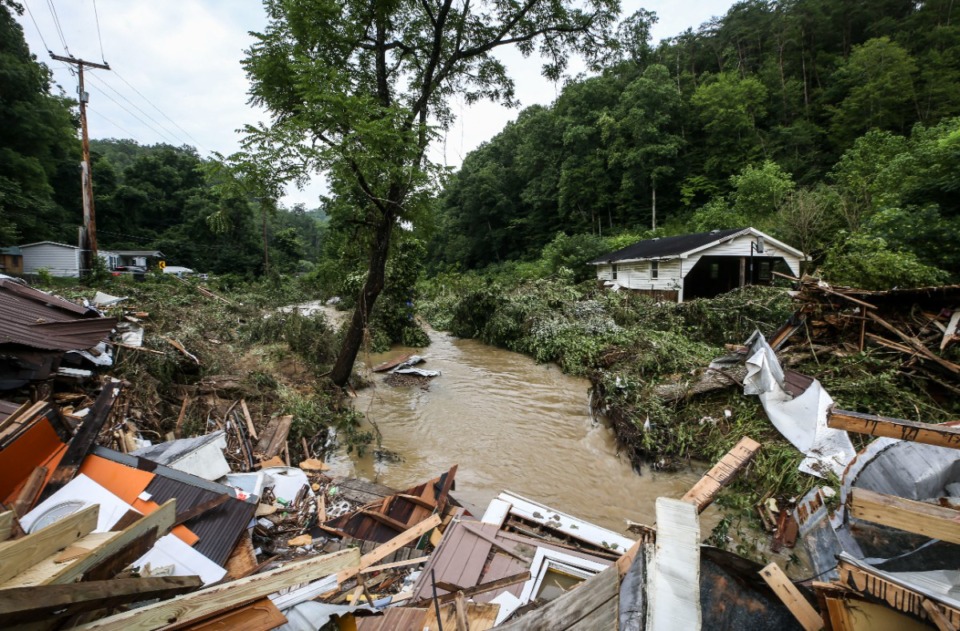 <strong>Debris from destroyed homes piles up near a concrete bridge over Grapevine Creek in Perry County after torrential rain caused flash flooding in Eastern Kentucky on July 28, 2022.</strong> (In partnership with the Mississippi River Basin Ag and Water Desk/Matt Stone, The Courier-Journal)