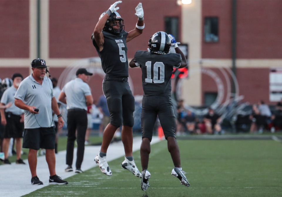 <strong>Houston receiver Shawne Jones (5) and Damon Sisa (10) celebrate after a touchdown during a Aug. 26, 2022 game against Briarcrest.</strong> (Patrick Lantrip/The Daily Memphian)