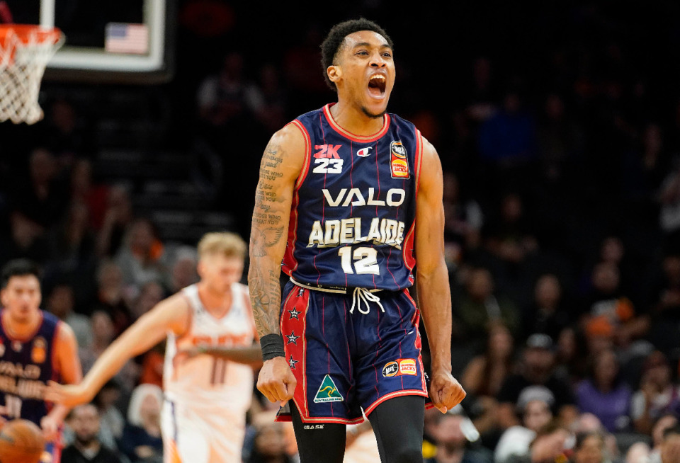 <strong>Adelaide 36ers&rsquo; Craig Randall II (12) celebrates back-to-back three-pointers against the Phoenix Suns on Sunday, Oct. 2, in Phoenix. Adelaide won 134-124, becoming the only NBL team to defeat an NBA squad.</strong> (Darryl Webb/Associated Press)