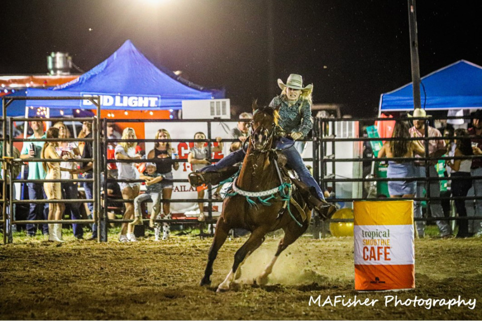 <strong>Danielle Fisher competes in Olive Branch's Bucking the Branch rodeo held in the city&rsquo;s entertainment district in September.</strong> (courtesy MAFisher Photography)
