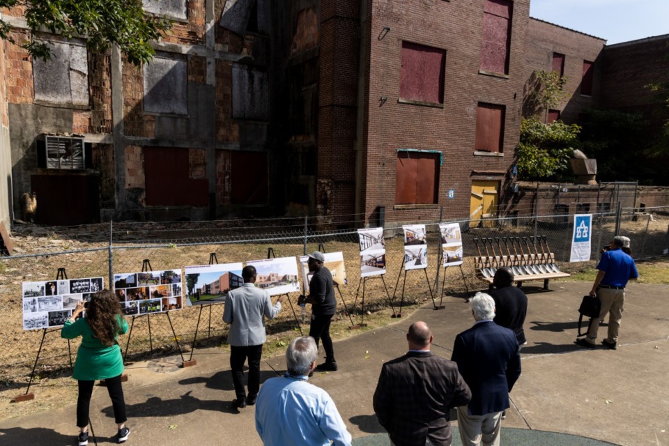 <strong>People look over renderings for the renovation of Melrose High during the groundbreaking ceremony Oct. 7.</strong> (Brad Vest/Special to The Daily Memphian)