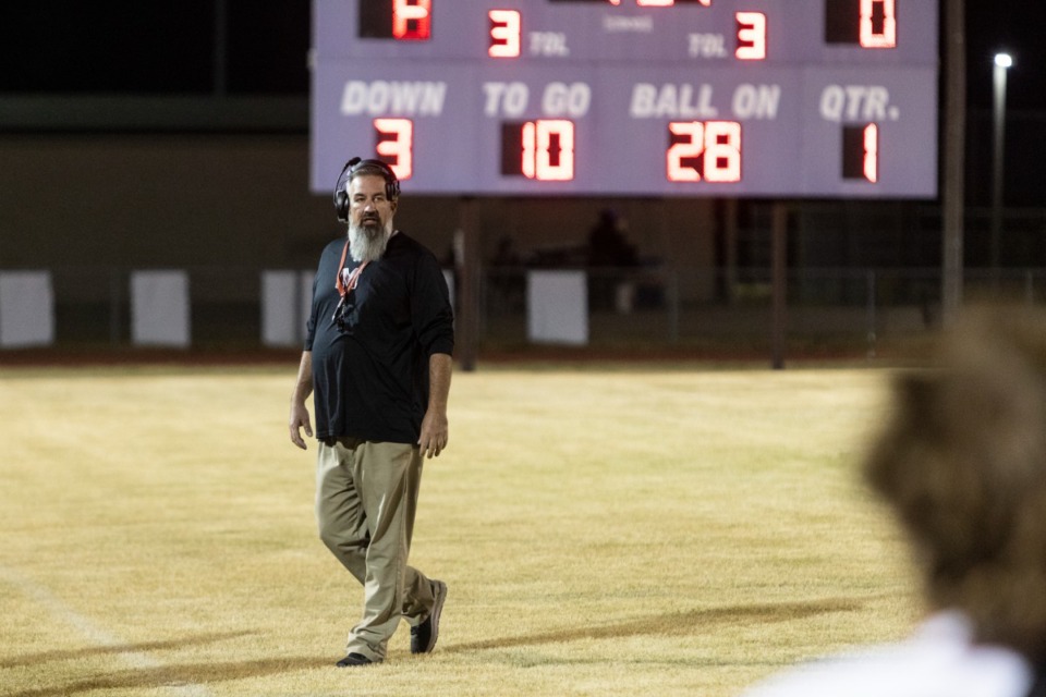 <strong>Munford&rsquo;s head coach Slad Calhoun walks out on the field during Friday night&rsquo;s game at Southwind High School between Southwind and Munford.</strong>(Brad Vest/Special to The Daily Memphian)