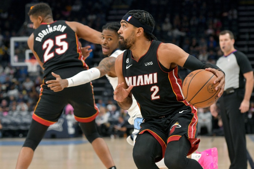 <strong>Miami Heat guard Gabe Vincent (2) tries to dribble past Memphis Grizzlies guard Ja Morant in the first half of a preseason game on Oct. 7, 2022.</strong> (Brandon Dill/AP)