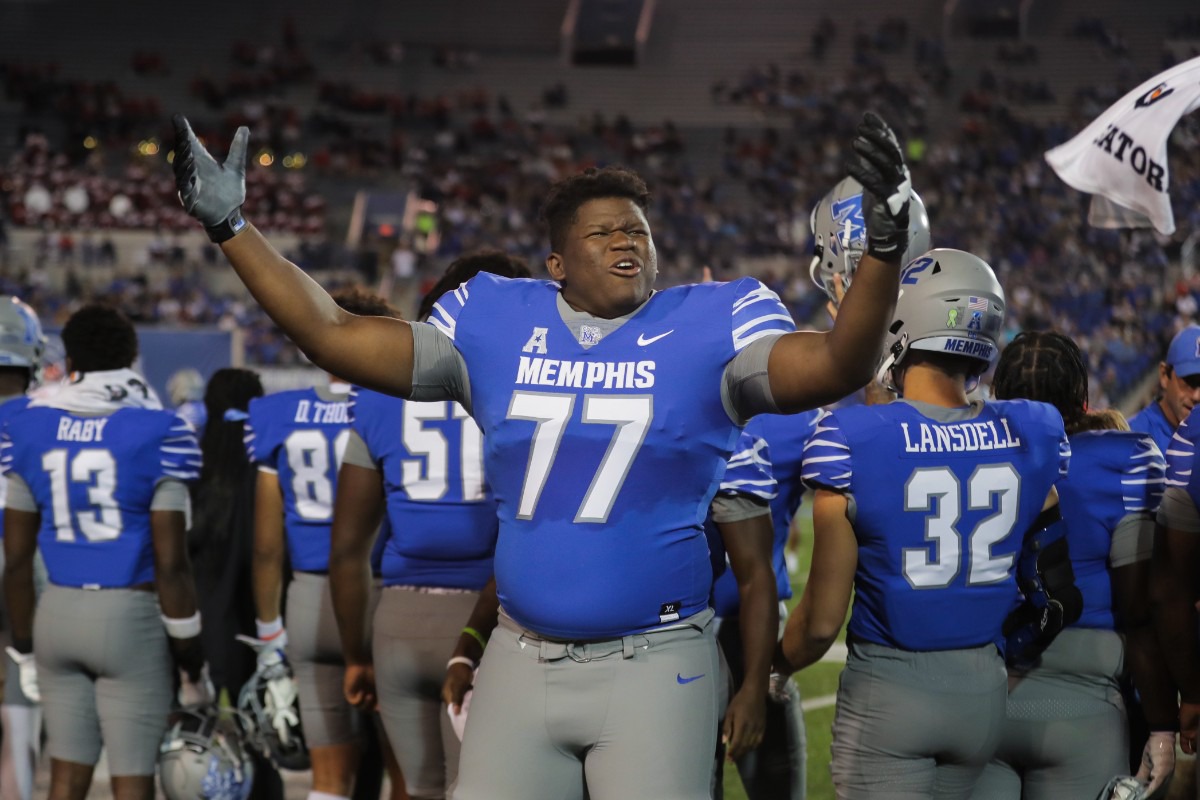 <strong>University of Memphis offensive lineman Kyndall McKenzie (77) hypes up the home crowd on Oct. 7, 2022, in the game against the University of Houston.</strong> (Patrick Lantrip/Daily Memphian)