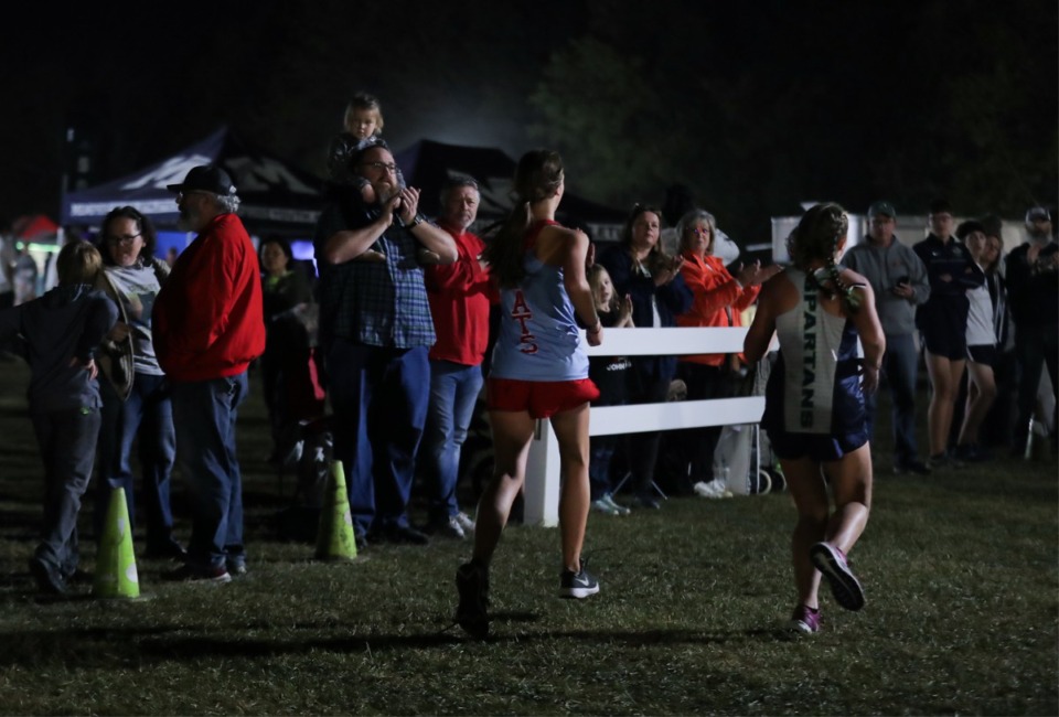 <strong>Spectators cheer on the runners during the high school cross-country races Saturday evening, which capped off a series of elementary, middle and high school races.</strong> (Patrick Lantrip/Daily Memphian)