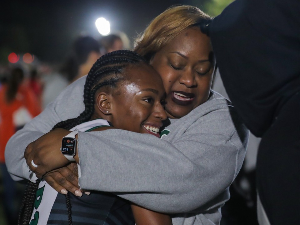 <strong>White Station High School runner Hannah Heaston hugs her mom, Heather, after running in the Frank Horton Night Classic at Shelby Farms Oct. 8, 2022.</strong> (Patrick Lantrip/Daily Memphian)