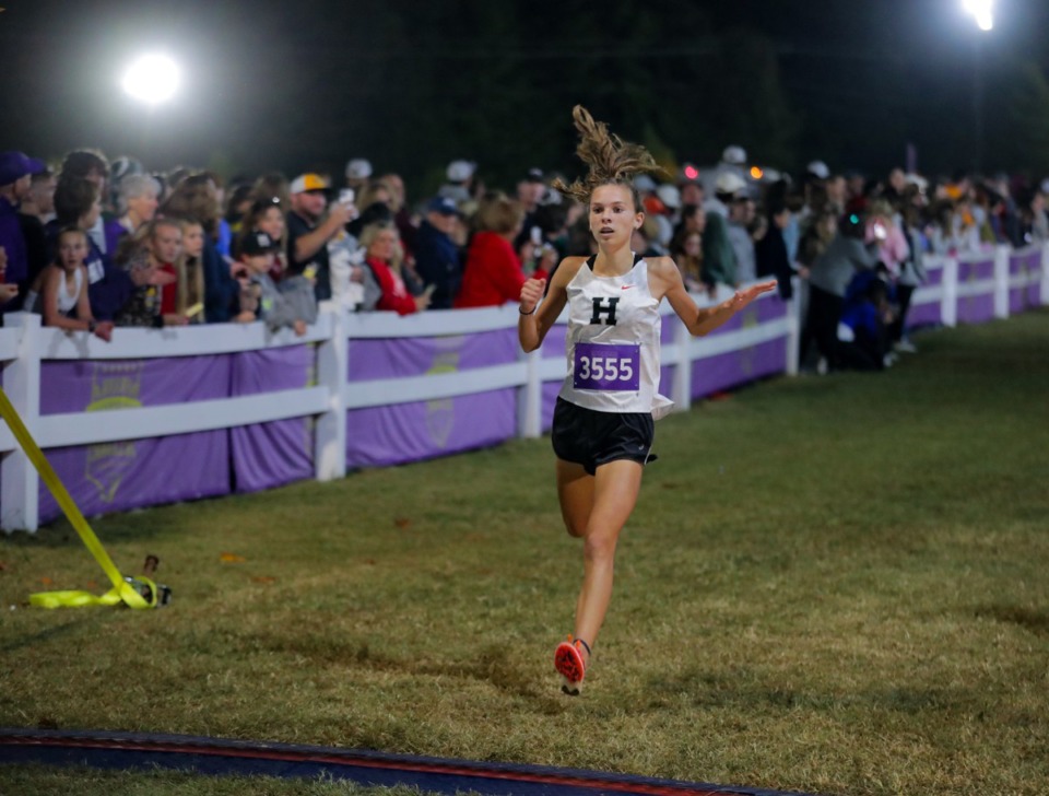 <strong>A Houston High School runner crosses the finish line of the Frank Horton Night Classic at Shelby Farms Oct. 8, 2022. Houston girls captured top honors and Hernando High girls placed second.</strong>&nbsp;(Patrick Lantrip/Daily Memphian)