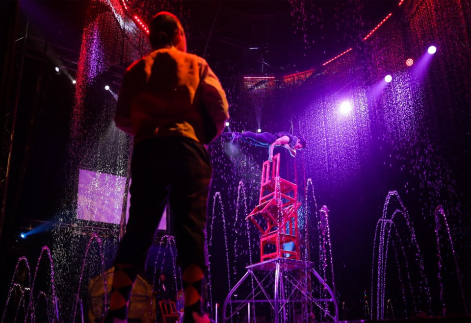 <strong>A performer balances on a stack of chairs during the Cirque Italia Water Circus.</strong> (Patrick Lantrip/The Daily Memphian)