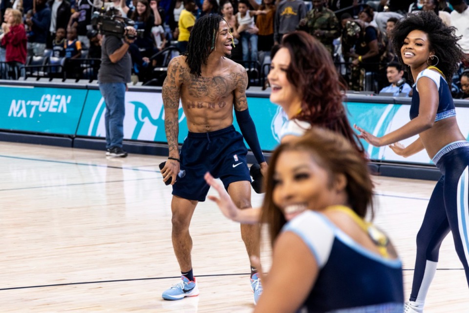 <strong>Ja Morant dances with the Grizz Girls during the Grizzlies&rsquo; annual open practice Sunday, Oct. 9 at the FedExForum.</strong> (Brad Vest/ Special to The Daily Memphian)