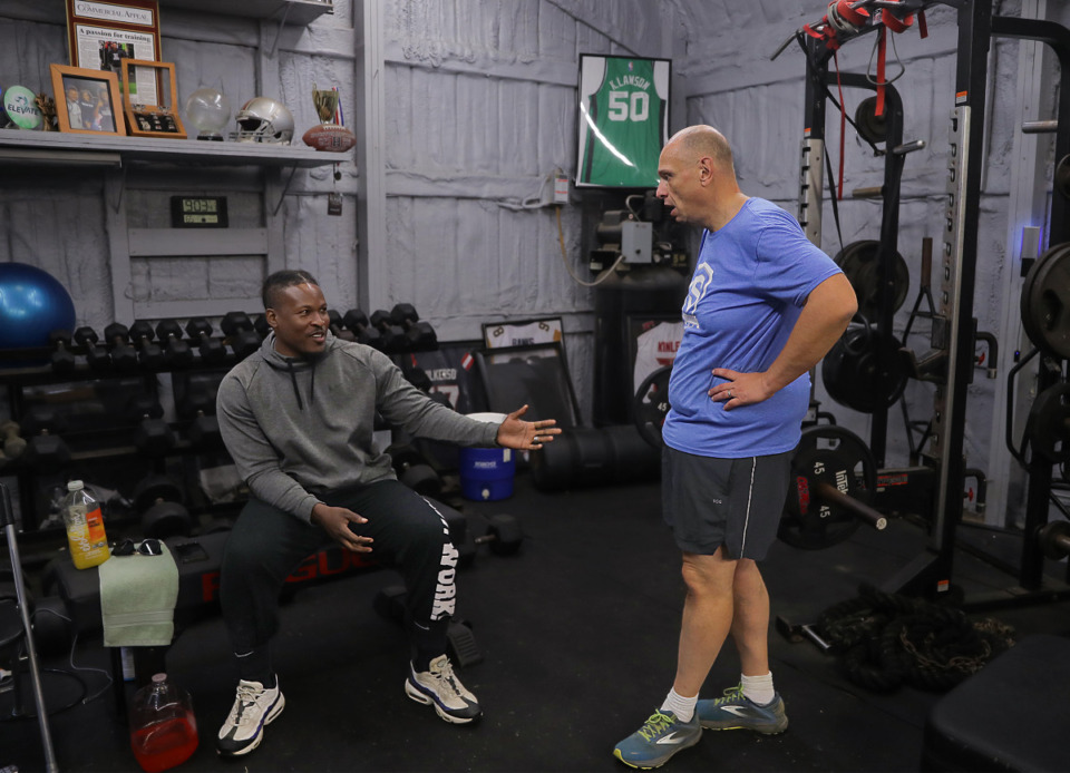 <strong>John Varlas talks with coach Raheem Shabazz, who has helped him through his weightloss journey.</strong> (Patrick Lantrip/The Daily Memphian)