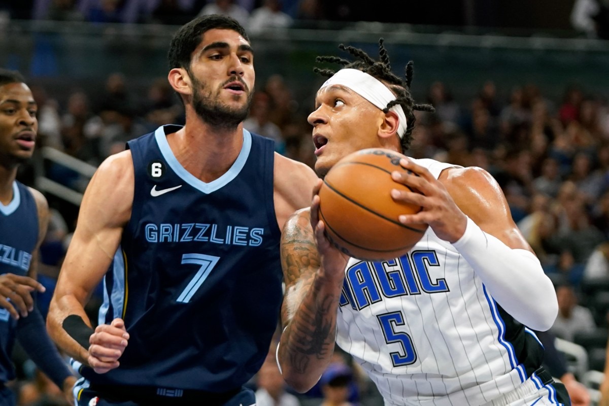 <strong>The Orlando Magic's Paolo Banchero (5) looks for a shot against Memphis Grizzlies' Santi Aldama (7)&nbsp;on Oct. 11, 2022, in Orlando, Florida.</strong> (John Raoux/AP)