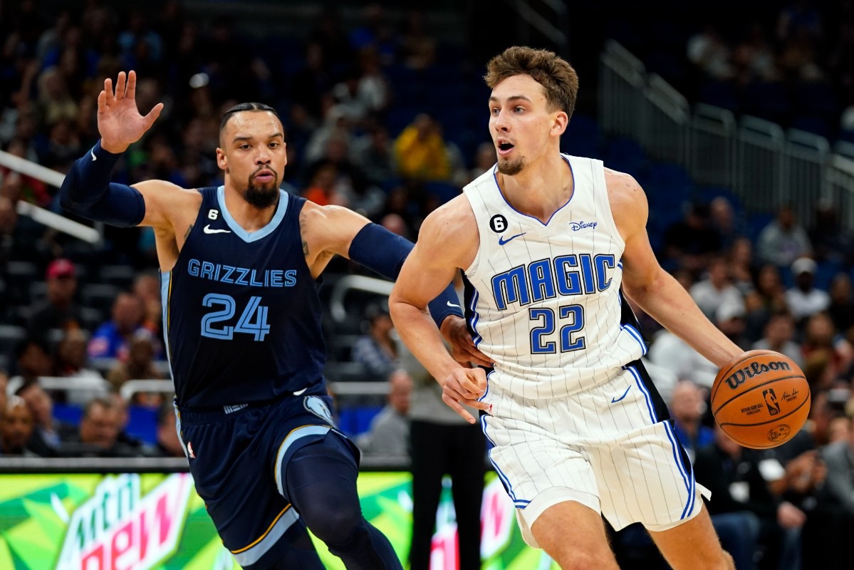 <strong>The Orlando Magic's Franz Wagner (22) drives around Memphis Grizzlies' Dillon Brooks (24)</strong>&nbsp;<strong>on Oct. 11, 2022, in Orlando, Florida.</strong> (John Raoux/AP)