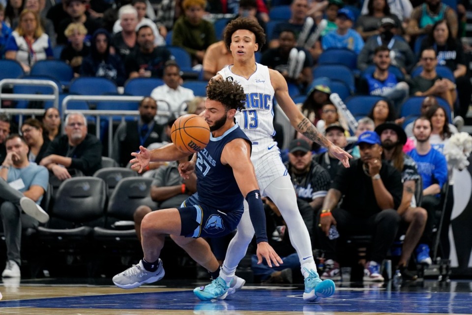 <strong>Memphis Grizzlies' David Roddy (27) falls as he is fouled by Orlando Magic's R.J. Hampton (13)&nbsp;on Oct. 11, 2022, in Orlando, Florida.</strong> (John Raoux/AP)