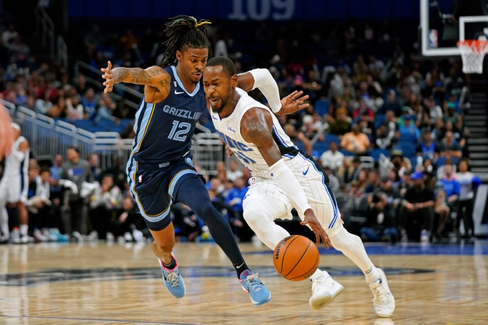 <strong>Orlando Magic's Terrence Ross, right, drives past Memphis Grizzlies' Ja Morant (12)</strong>&nbsp;<strong>on Oct. 11, 2022, in Orlando, Florida.</strong> (John Raoux/AP)