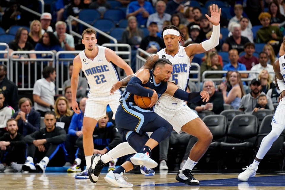 <strong>Memphis Grizzlies' Dillon Brooks, center, makes a move to the basket against Orlando Magic's Franz Wagner (22)&nbsp;on Oct. 11, 2022, in Orlando, Florida.</strong> (John Raoux/AP)