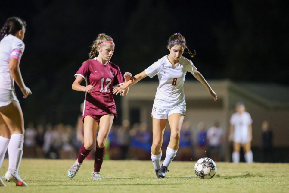 <strong>ECS&rsquo; Allie Broadway (12) battles St. George&rsquo;s Sarah Kilmurray (8) for the ball at the West Region semifinal game at St. George&rsquo;s on Oct. 11, 2022.</strong> (Ryan Beatty/Special to The Daily Memphian)