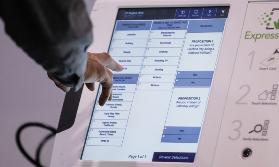 <strong>Shelby County residents work a sample ballot on the new voting machines at the Benjamin L. Hooks Central Library. The November election will be the debut of the new voting machines.</strong> (Patrick Lantrip/The Daily Memphian)