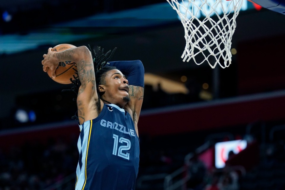 <strong>Memphis Grizzlies guard Ja Morant goes for a dunk during the second half of an NBA preseason basketball game against the Detroit Pistons on Thursday, Oct. 13, 2022, in Detroit.</strong> (Carlos Osorio/AP)