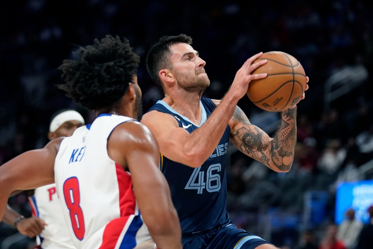 <strong>Memphis Grizzlies guard John Konchar (46) attempts a shot as Detroit Pistons guard Braxton Key (8) defends on Oct. 13, 2022, in Detroit.</strong> (Carlos Osorio/AP)