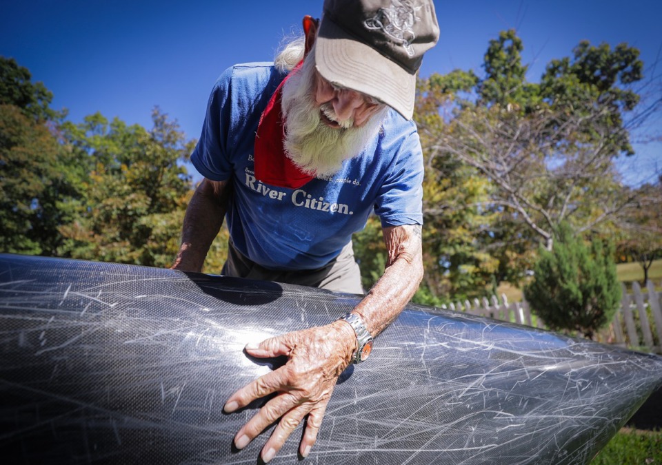 <strong>Dale Sanders inspects the bottom of his canoe. A documentary called &ldquo;Greybeard: The Man, the Myth, the Mississippi&rdquo; is being made now chronicle his most recent accomplishment.&nbsp;</strong>(Patrick Lantrip/The Daily Memphian)