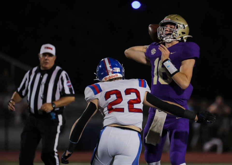 <strong>CBHS quarterback Jack McLaughlin (16) gets hit as he passes on Oct. 14, 2022, in the game against MUS.</strong> (Patrick Lantrip/Daily Memphian)