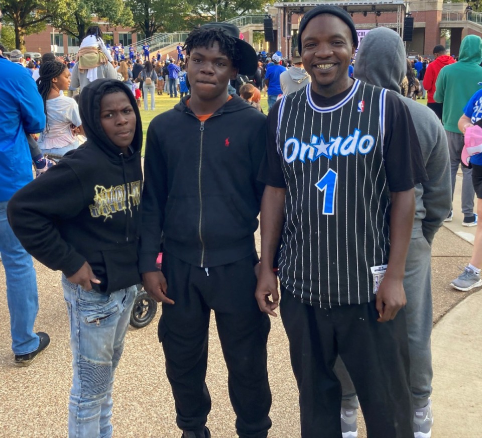 <strong>Tigers fan Broderick Culp (far right) drove with his sons from Byhalia, Mississippi, to attend Saturday&rsquo;s Memphis Basketball Block Party on Oct. 15, 2022.</strong> (Tim Buckley/The Daily Memphian)