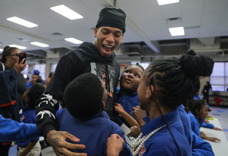 <strong>NLE Choppa is greeted by kids of Conerstone Prep Denver in the Frayser neighborhood of Memphis Oct. 18, 2022.</strong> (Patrick Lantrip/The Daily Memphian)