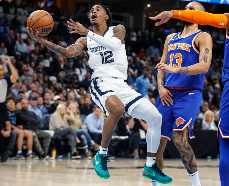 <strong>Memphis Grizzlies guard Ja Morant (left) drives the lane against the New York Knicks on Wednesday, Oct. 19, 2022.</strong> (Mark Weber/The Daily Memphian)