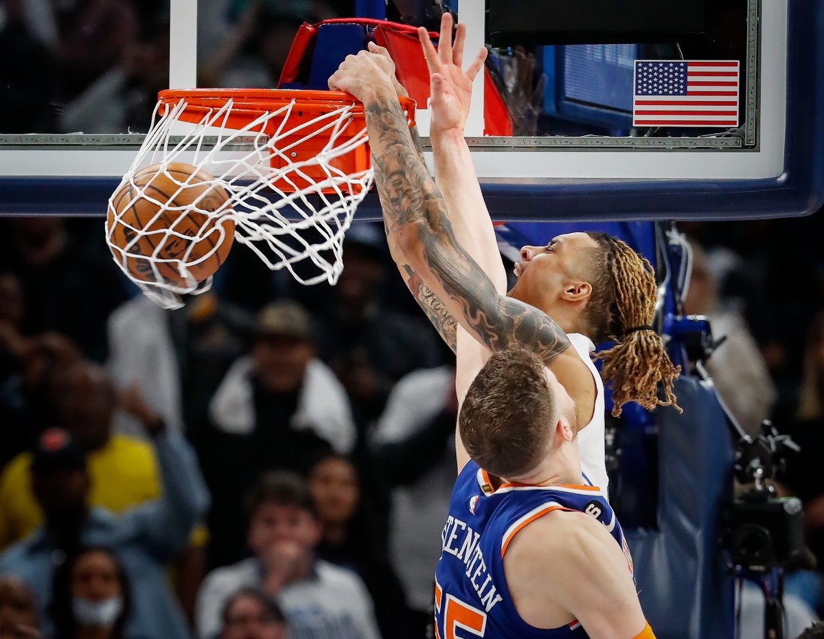 <strong>Memphis Grizzlies forward Brandon Clarke (right) dunks over New York Knicks defender Isaiah Hartenstein (left) on Wednesday, Oct. 19, 2022.</strong> (Mark Weber/The Daily Memphian)