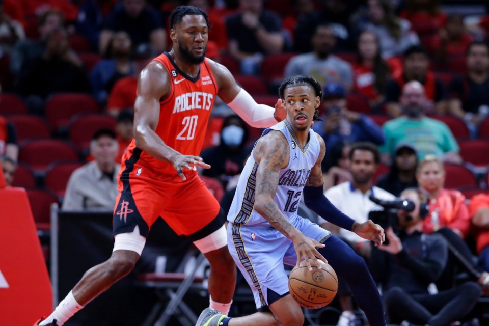 <strong>Memphis Grizzlies guard Ja Morant (12) looks to drive around Houston Rockets forward Bruno Fernando (20) on Oct. 21, 2022, in Houston.</strong> (Michael Wyke/AP)