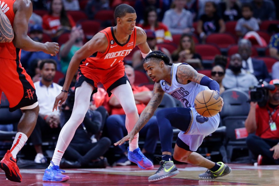 <strong>Memphis Grizzlies guard Ja Morant, right, tries to pass Houston Rockets forward Jabari Smith Jr. (1) on Friday, Oct. 21, 2022, in Houston.</strong> (Michael Wyke/AP)
