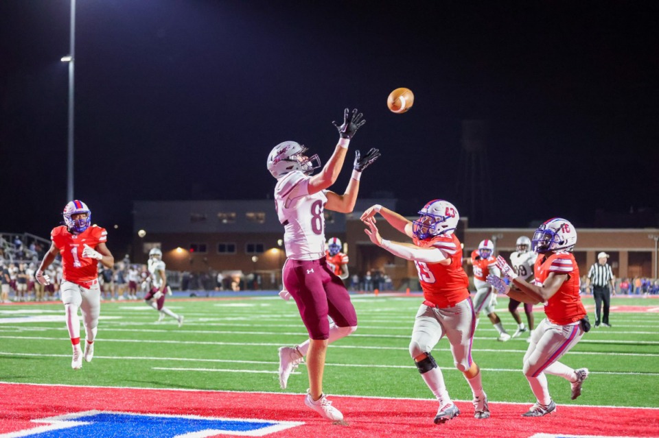 <strong>Collierville tight end Eli Sissons (82) jumps over Bartlett&rsquo;s Nick Luster (43) for a touchdown on Oct. 21, 2022.</strong> (Ryan Beatty/Special to The Daily Memphian)