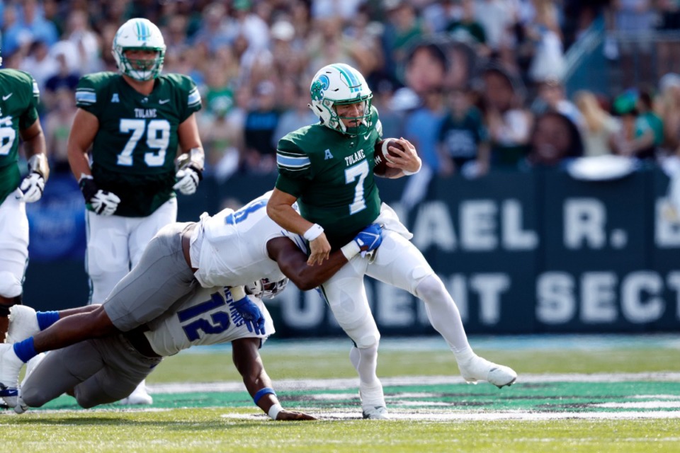 <strong>Tulane quarterback Michael Pratt (7) is tackled by Memphis linebacker Xavier Cullens (8) during the first half of an NCAA college football in New Orleans, Saturday, Oct. 22, 2022.</strong> (AP Photo/Tyler Kaufman)