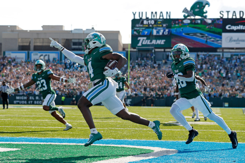 <strong>Tulane wide receiver Jha'Quan Jackson (4) returns a kickoff to score a touchdown during the first half of an NCAA college football against Memphis in New Orleans, Saturday, Oct. 22, 2022.</strong> (AP Photo/Tyler Kaufman)