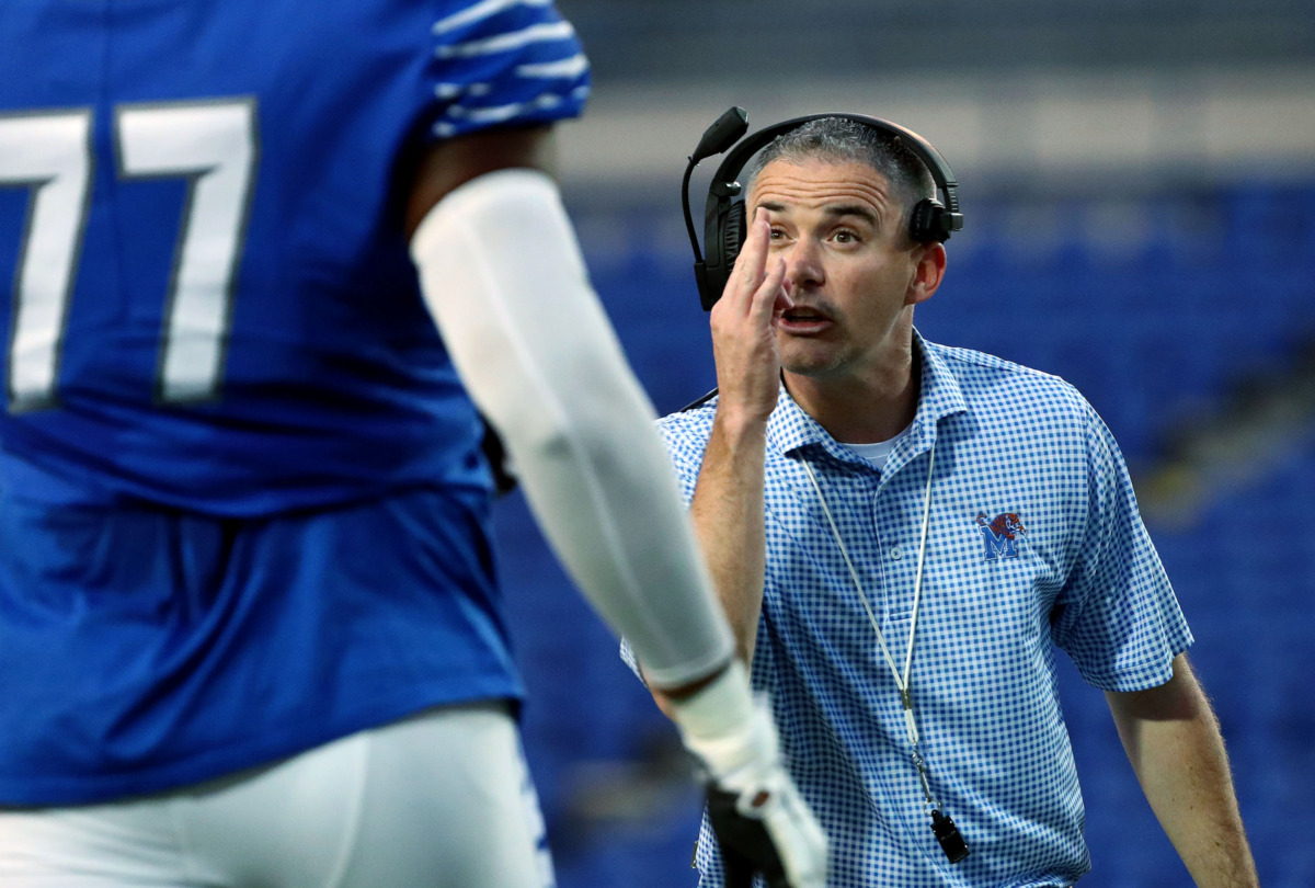 <strong>University of Memphis football coach Mike Norvell talks with one of his players during the annual Friday Night Stripes scrimmage on April 12, 2019. Norvell is going into his fourth season as the Tigers' head coach.</strong>&nbsp;(Houston Cofield/Daily Memphian)