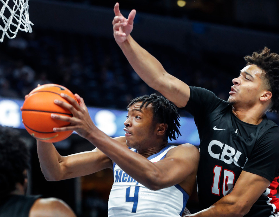 <strong>Memphis Tigers forward Chandler Lawson (left) grabs a rebound in front of Christian Brothers University defender Madison Monroe (right) during action on Sunday, Oct. 23, 2022.</strong> (Mark Weber/The Daily Memphian)