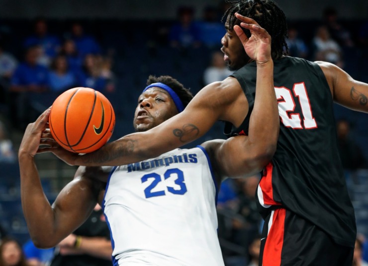 <strong>Memphis Tigers center Malcolm Dandridge (left) is fouled by Christian Brothers University defender Darell Johnson (right) while grabbing a rebound during action on Sunday, October 23, 2022.</strong> (Mark Weber/The Daily Memphian)