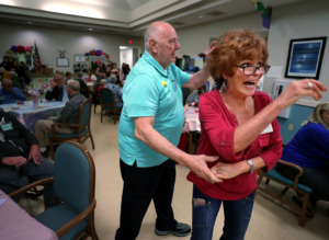 <strong>Jim S. (left) and Toni Rhylander swing dance to live music at the 10th annual senior prom hosted by Page Robbins Adult Day Center. The center encourages patients with Alzheimer's disease and dementia to attend to promote creating new memories.</strong> (Houston Cofield/Daily Memphian)